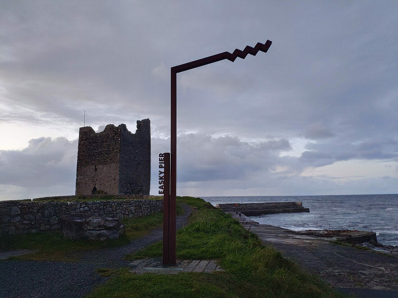 Wild Atlantic Way Easky Pier sign and O'Dowd castle.jpg